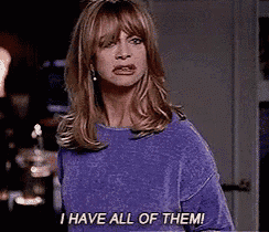 a woman in a purple sweater says i have all of them