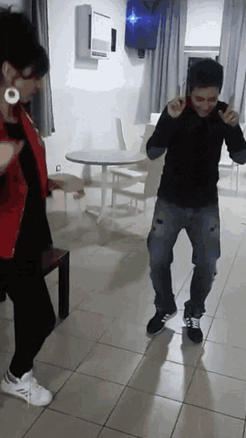 a man and woman are dancing together in a room
