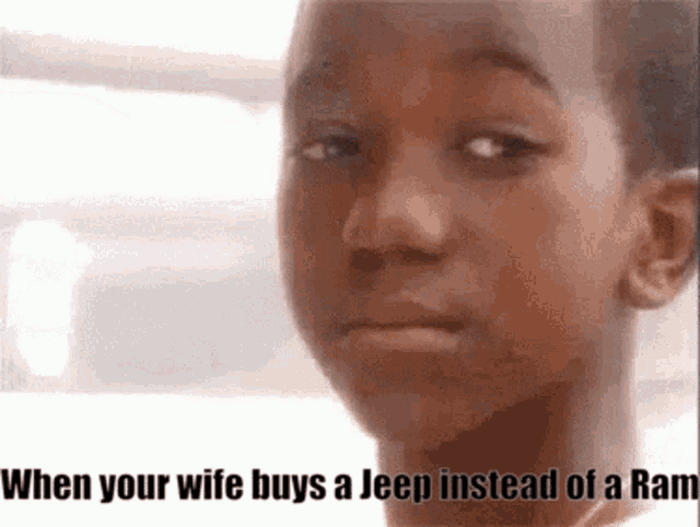 a young boy is making a funny face with the words when your wife buys a jeep
