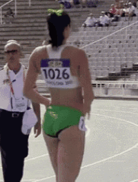 a female runner with the number 1036 on her back