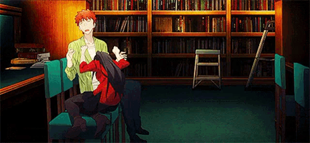 a man and a woman are sitting in a library .