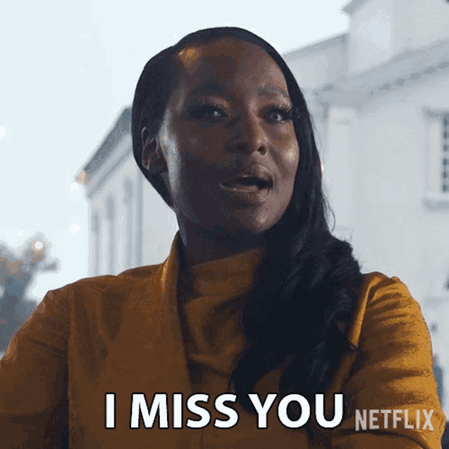 a woman in a yellow jacket says i miss you
