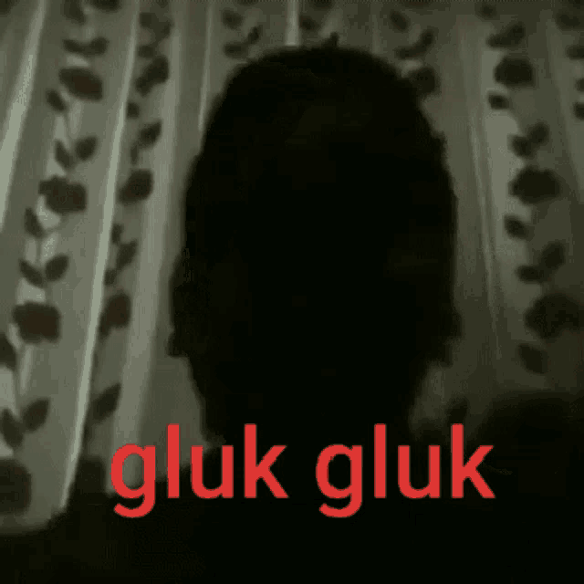 a silhouette of a person with the words gluk gluk in red