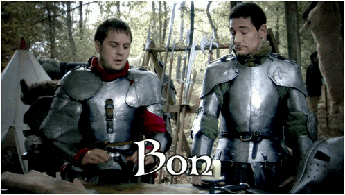 two men in armor are standing next to each other and the word bon is on the bottom