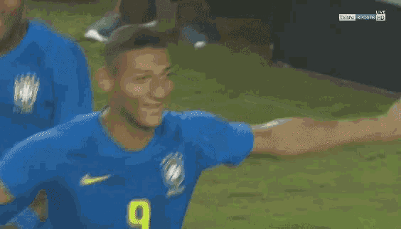 two soccer players on a field with chevrolet and brahma advertisements in the background