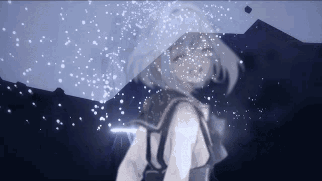 a girl holding an umbrella with snow falling on her head