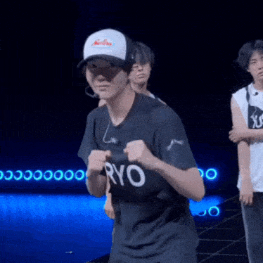 a man wearing a black shirt that says ryo