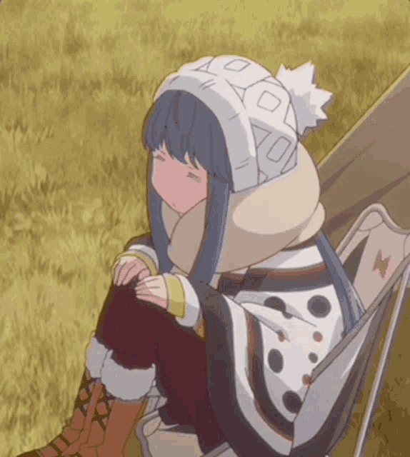 a girl is sitting in a chair with her eyes closed and a hat that has the number 70 on it