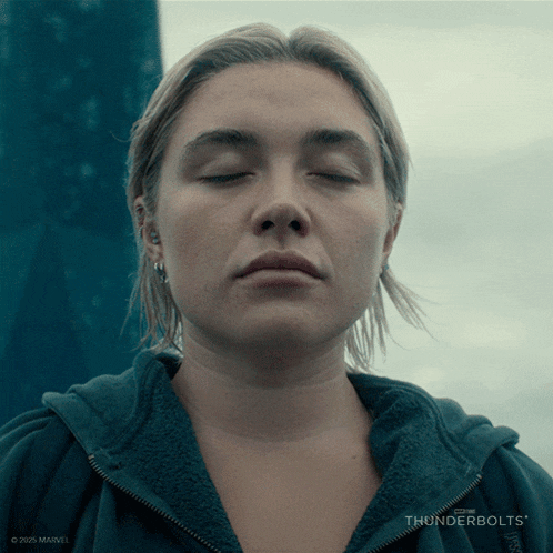 a close up of a woman 's face with thunderbolts written on the bottom right