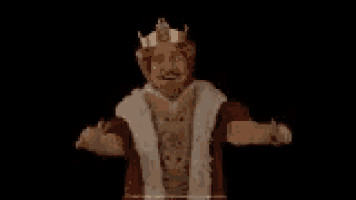 a man in a king costume is giving a thumbs up sign .