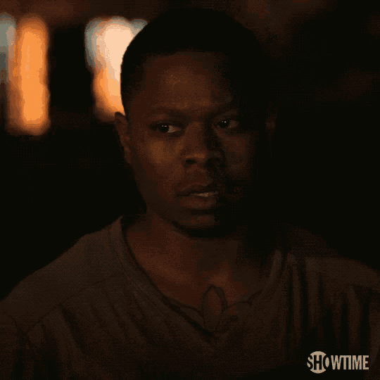 a close up of a man 's face with showtime on the bottom right