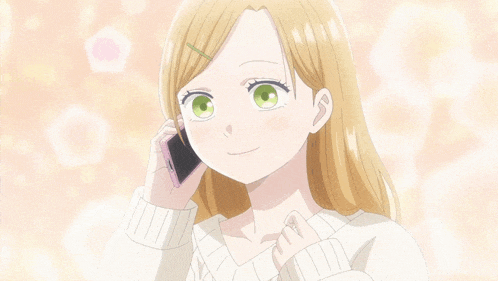 a girl with blonde hair and green eyes talking on a cell phone