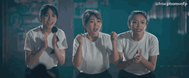 three girls in white shirts are standing next to each other with the hashtag trucphamvnfp