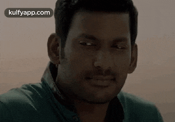 a close up of a man 's face with the words kulfyapp.com on the bottom