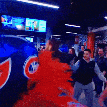 a group of people are standing in front of a sign that says ' montreal ' on it
