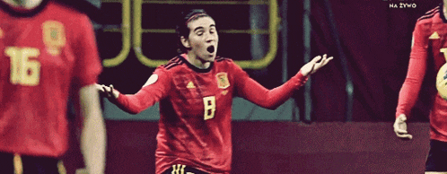 a soccer player in a red jersey with the number 8 on it