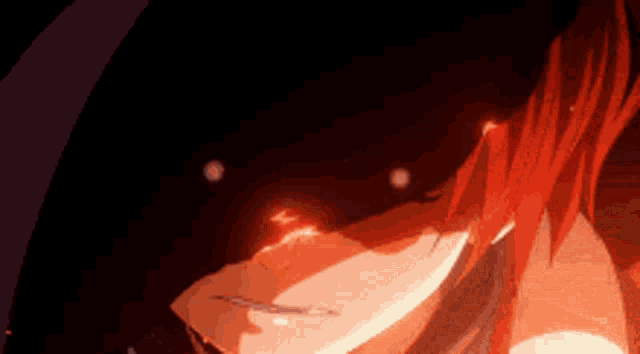 a close up of a person 's face with fire coming out of it .