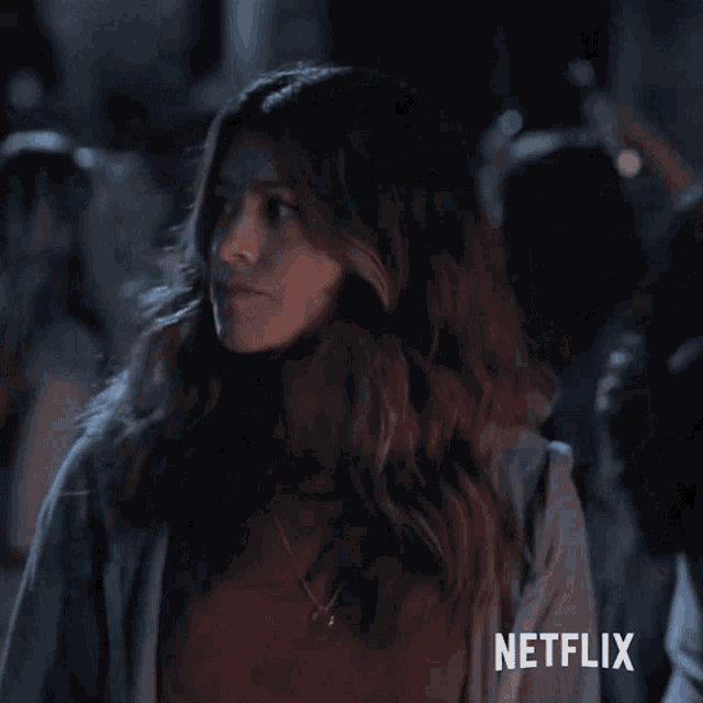 a close up of a woman 's face with the word netflix on the bottom right corner .