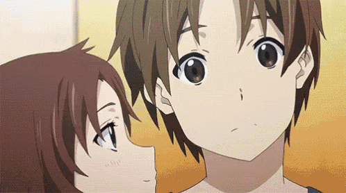 a boy and a girl are looking at each other in a anime .