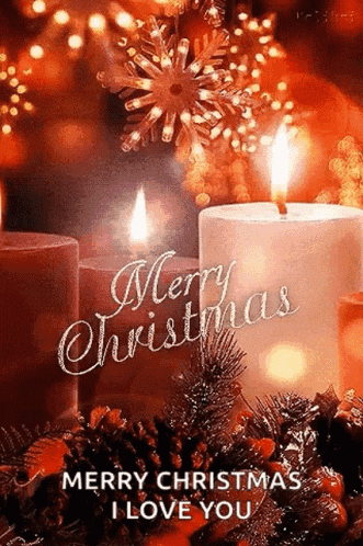 a merry christmas card with two lit candles and pine cones