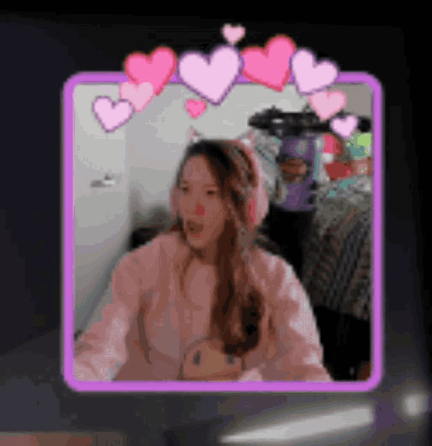 a picture of a girl with hearts around her