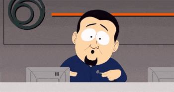 a cartoon character with a beard is pointing at a computer monitor
