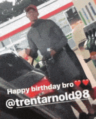 a man standing next to a car with the words happy birthday bro @trentarnold98