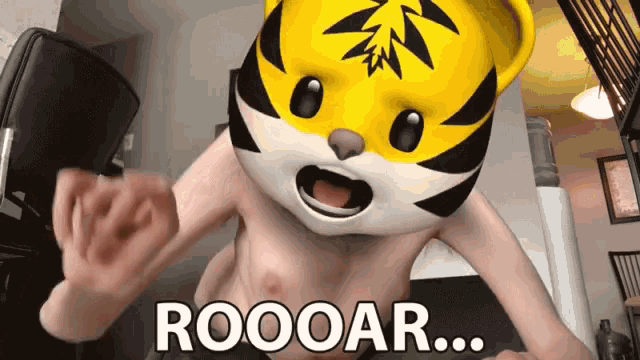 a person with a tiger mask on their head and the words roooar on the bottom