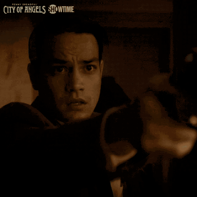 penny dreadful city of angels showtime poster with a man in the dark