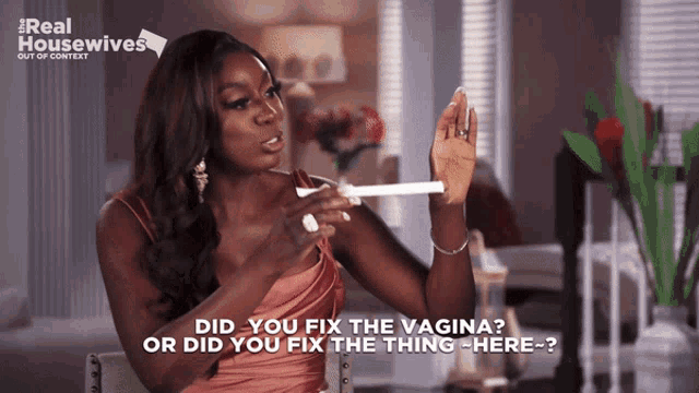 a woman holding a pregnancy test says did you fix the vagina