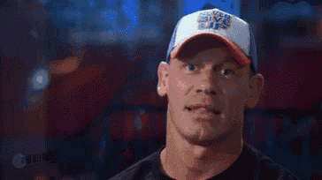 a man wearing a baseball cap that says `` never give up '' .