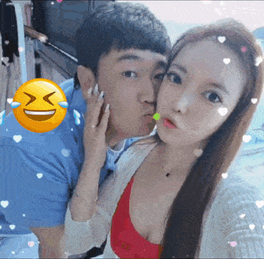 a man is kissing a woman on the cheek with a smiley face behind them