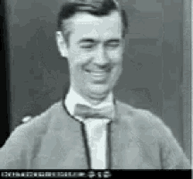 a black and white photo of a man wearing a bow tie and a jacket .