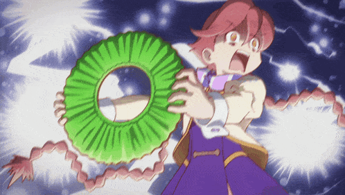 a girl with red hair is holding a green circle