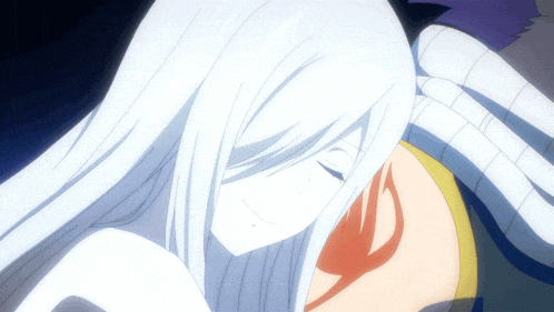 a woman with long white hair is laying down