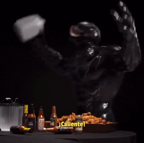 a person is pouring milk on a plate of fried chicken
