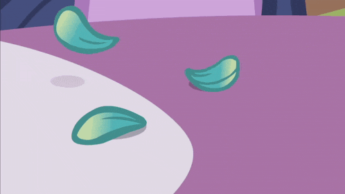 a purple background with a few green petals laying on it