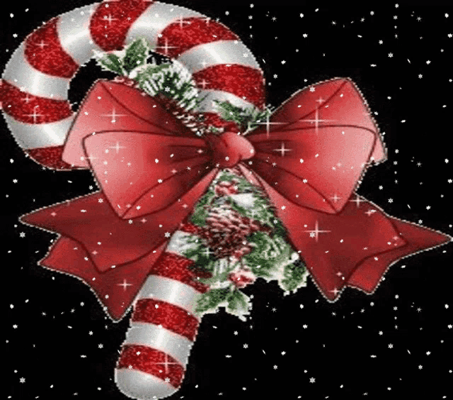 a red and white striped candy cane with a red bow