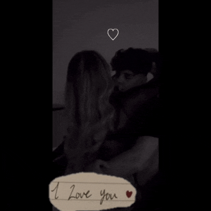 a black and white photo of a man and woman hugging with the words " i love you " written in the corner