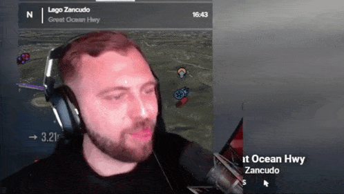 a man wearing headphones and a microphone is playing a video game called lago zancudo