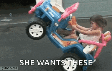 a little girl is sitting in a toy car with the words `` she wants these '' written below her .