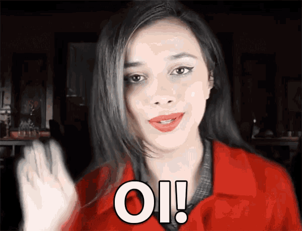 a woman in a red jacket says " oh " with her hand