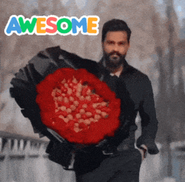 a man is holding a large bouquet of red roses and the words awesome are behind him