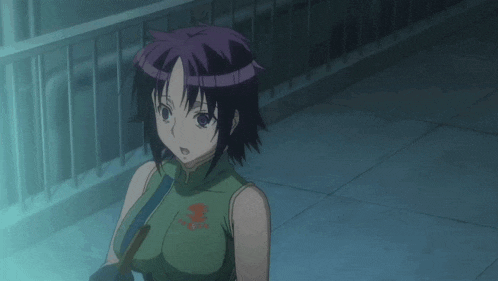 a girl in a green dress is sitting on the floor