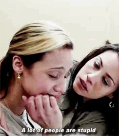 two women are hugging each other and one of them is crying while the other says a lot of people are stupid .