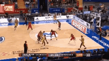 a basketball game is being played with a turkish airlines ad