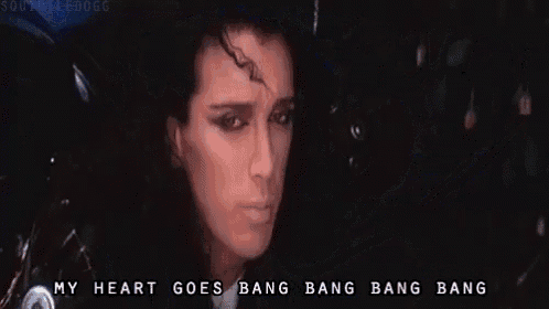 a bunch of roses are on the side of a motorcycle with the words my heart goes bang bang bang bang