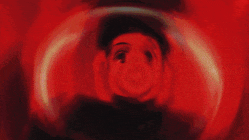 a close up of a person in a red light