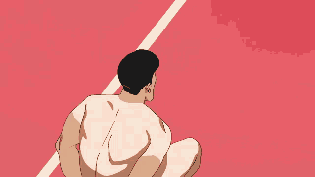 a naked man is squatting down on a red surface