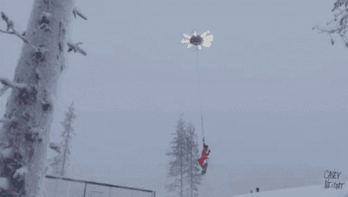 a person in a santa suit is skiing down a snow covered slope